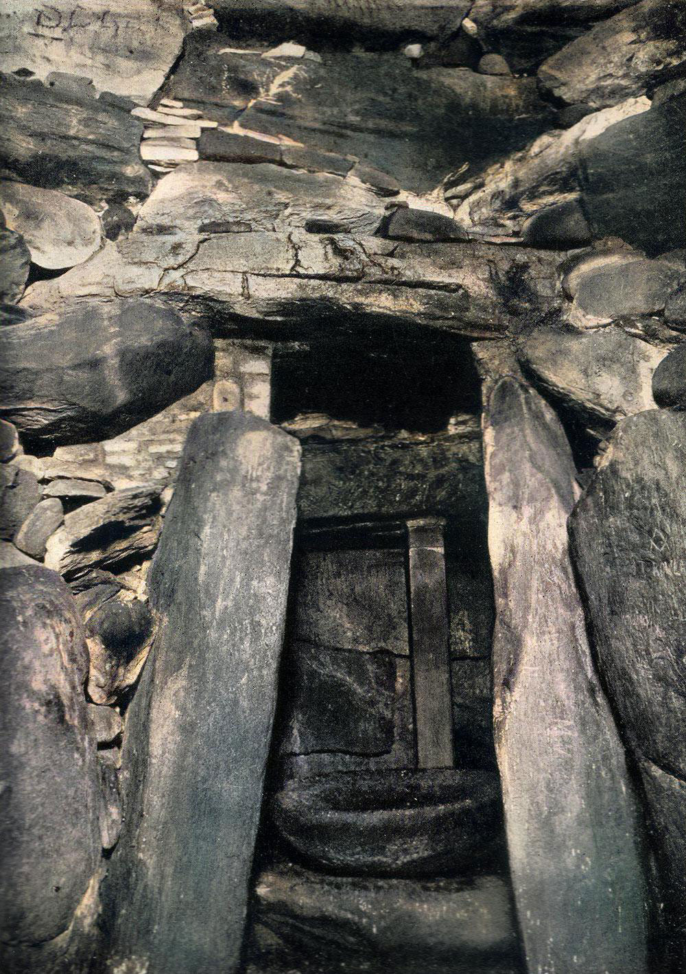 The right-hand or east recess within the chamber of Newgrange. The photograph was taken by Dublin photographer Thomas Mason around 1920.