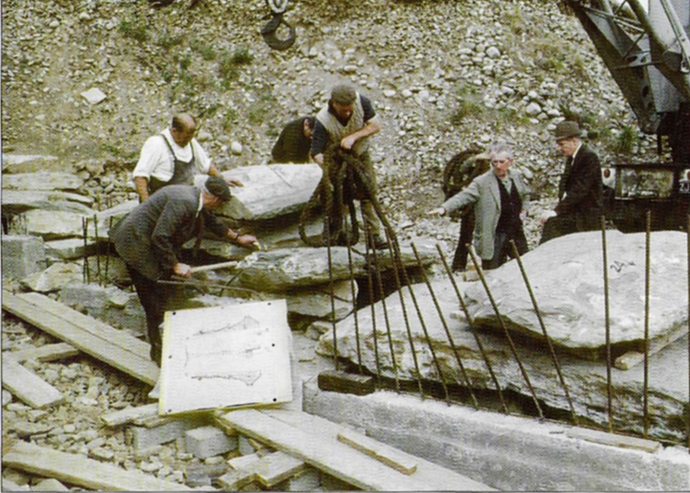 Michael O'Kelly and the O.P.W. reconstructing the dismantled roof-box at Newgrange.