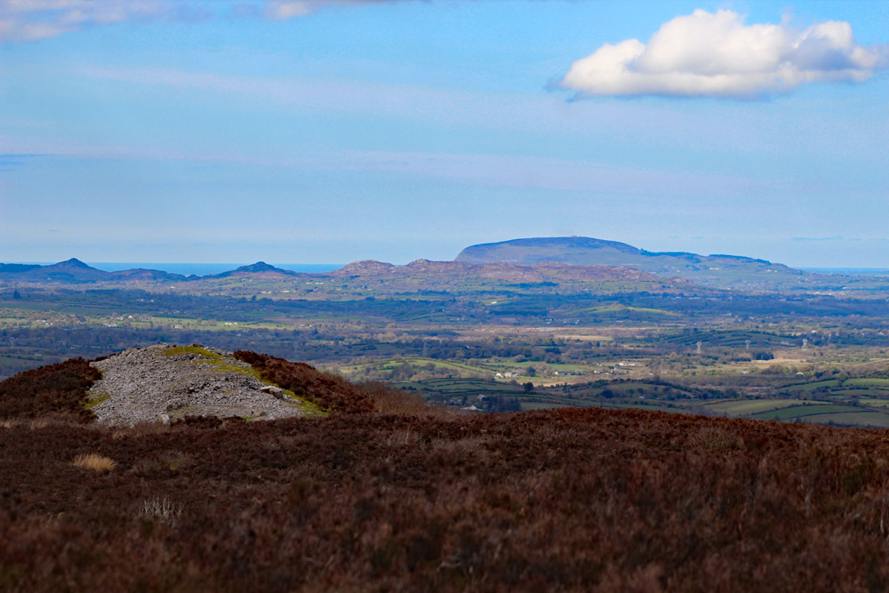 Looking
   north across Cairn E to Queen Maeve's cairn on Knocknarea Mountain.