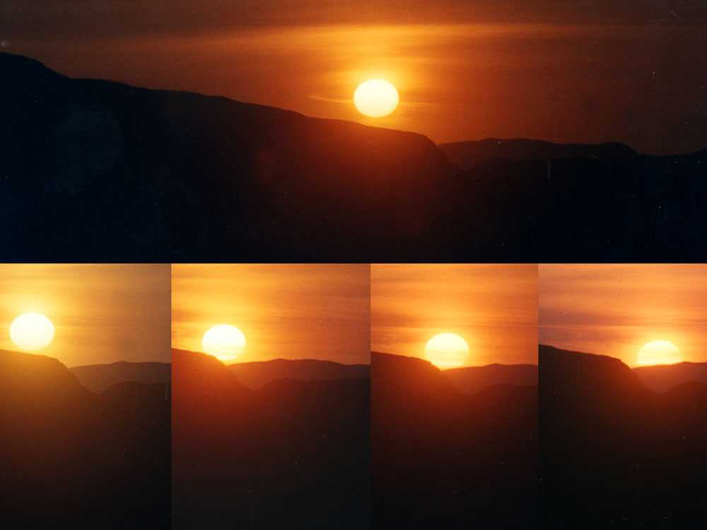 The sun appears to roll down the hill towards the notch at midsummer when viewed from Cairn A.