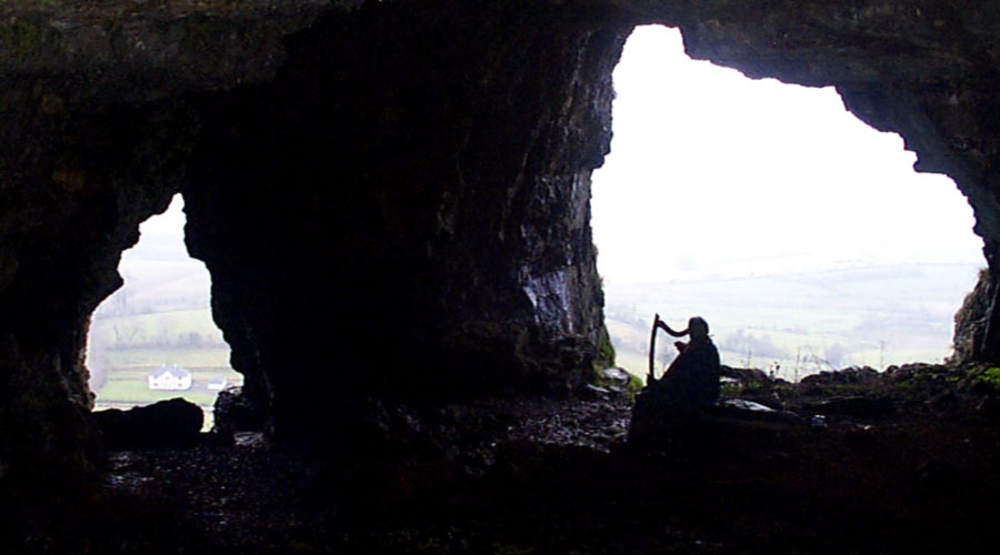Jo Coffey playing her harp in Cormac's Cave.