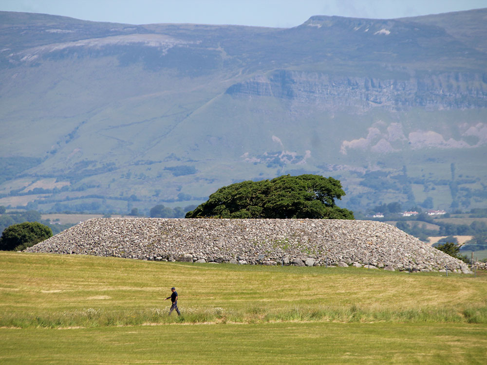 The restored cairn at Listoghil, the focal monument at Carrowmore with Kingsmountain as a backdrop.