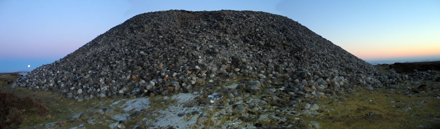 View of the full moon rising in January 2011 from Queen
        Maeve's Cairn on the summit of Knocknarea. The moon is rising over Cope's Mountain to the northeast.