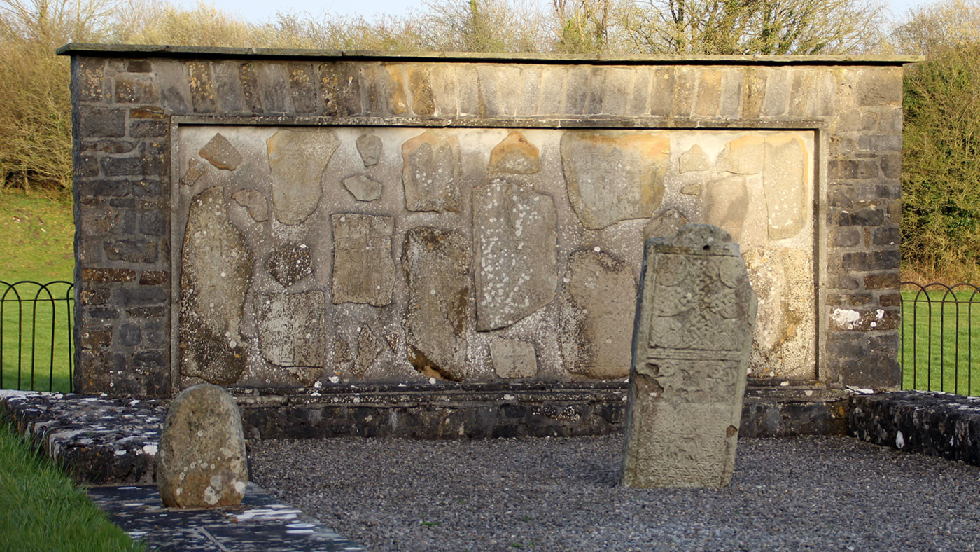 The Gallen Priory grave-slabs are set into 
    a wall of what was once the gable of an early church. 