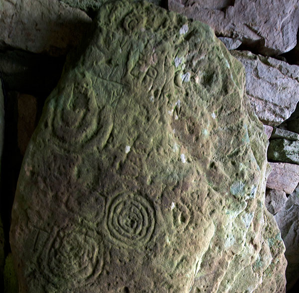 Decorated stone in the passage of Cairn T. 