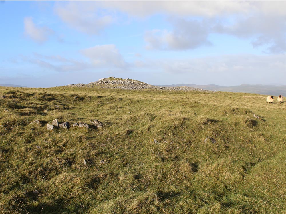 An example of the hut foundations on Knocknashee, with the north cairn in the distance.